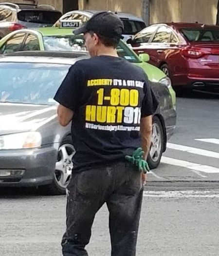 Man wearing 1-800-HURT-911 Bronx accident lawyer tshirt