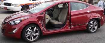 door removed from the red car which was struck by the silver SUV