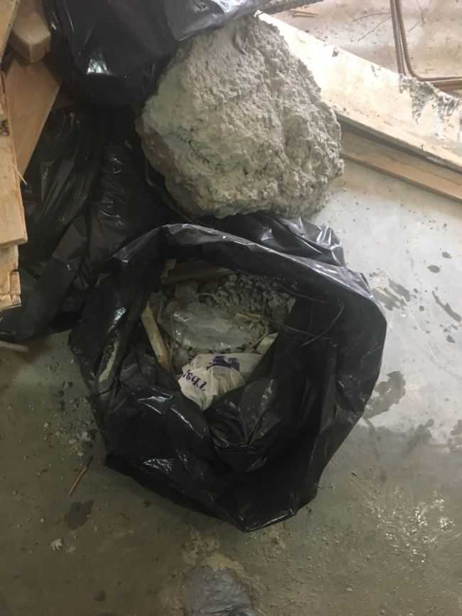 cement in garbage bags thrown out of window at construction site accident