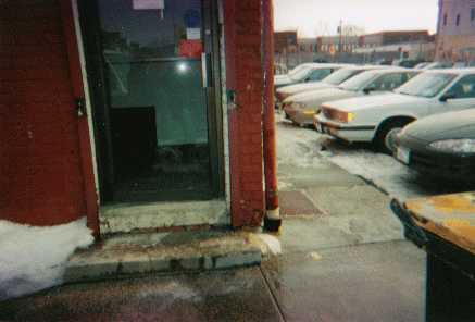 slip and fall on ice in front of door to store in parking lot